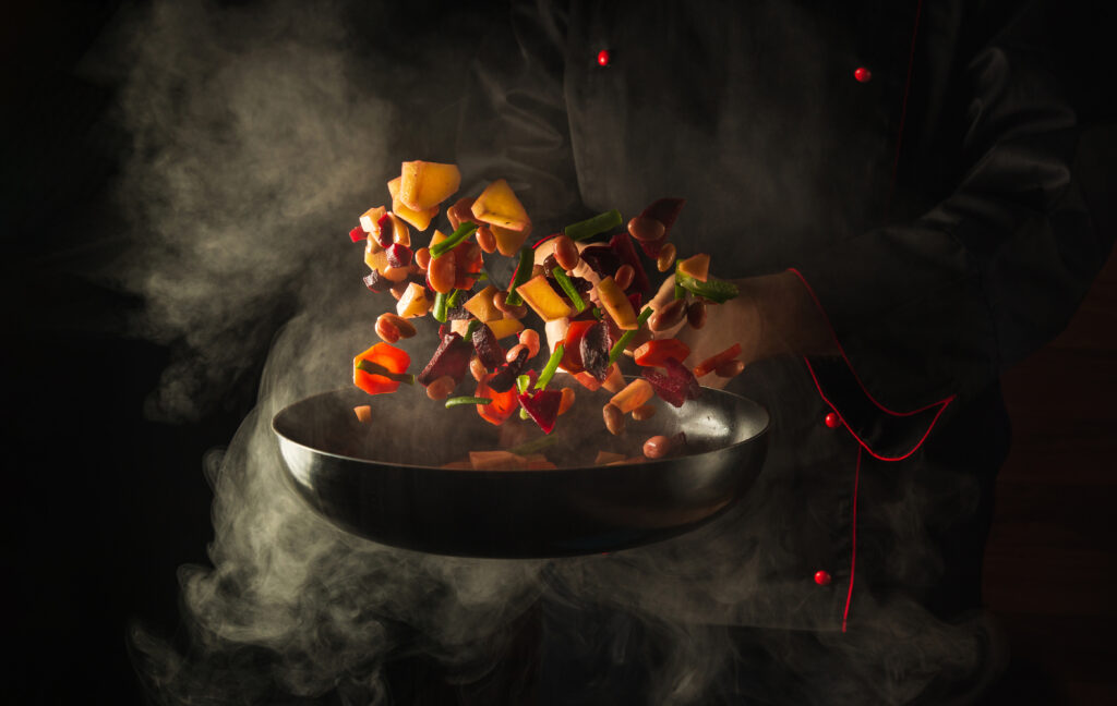 chef-prepares-food-hot-pan-with-steam