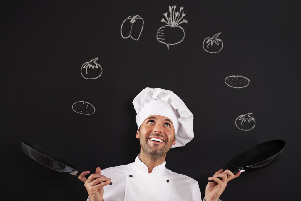 handsome-chef-jugglery-with-vegetable